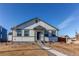 Craftsman style home with gray accents and a landscaped front yard at 2937 Pershing St, Strasburg, CO 80136