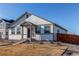 House exterior with gray accents, walkway, and wood fence at 2937 Pershing St, Strasburg, CO 80136