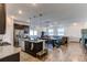 Open concept kitchen with island, dark cabinets, and granite counters at 2937 Pershing St, Strasburg, CO 80136