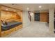 Finished basement with a bed, staircase, carpet, recessed lighting, and a chalkboard at 7750 S Glencoe Way, Centennial, CO 80122
