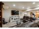 Finished basement with lounge and entertainment area, workout area, carpet, and recessed lighting at 7750 S Glencoe Way, Centennial, CO 80122