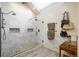 Bathroom includes a marble shower, pebble floor, and built in shelving niche at 7750 S Glencoe Way, Centennial, CO 80122