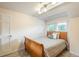 Neutral bedroom with a queen bed, white door, and large window at 7750 S Glencoe Way, Centennial, CO 80122