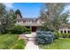 Charming two-story home with mature landscaping and a welcoming front entrance at 7750 S Glencoe Way, Centennial, CO 80122