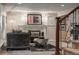 Cozy living room showcasing a fireplace, decorative artwork, and comfortable seating at 7750 S Glencoe Way, Centennial, CO 80122