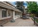 Beautiful patio with outdoor furniture and grill, perfect for relaxing and entertaining guests at 7750 S Glencoe Way, Centennial, CO 80122