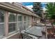 Relaxing patio with seating area near sliding glass doors, creating a seamless indoor/outdoor living experience at 7750 S Glencoe Way, Centennial, CO 80122