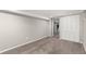 Carpeted basement room with neutral paint, closets, and a doorway at 1463 Dahlia St # 2, Denver, CO 80220