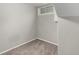 A small carpeted room in the basement with a window at 1463 Dahlia St # 2, Denver, CO 80220