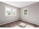 Bright, carpeted bedroom featuring multiple windows for natural light at 1463 Dahlia St # 2, Denver, CO 80220