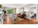 Bright living room featuring a fireplace, hardwood floors, and natural light at 1463 Dahlia St # 2, Denver, CO 80220