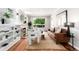 Bright living room featuring a fireplace, hardwood floors, and natural light at 1463 Dahlia St # 2, Denver, CO 80220