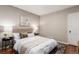 Cozy main bedroom featuring neutral colors, soft lighting, and tasteful decor at 1463 Dahlia St # 2, Denver, CO 80220