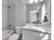 Bright bathroom includes shower-tub combo, white tiled walls, and a modern single sink vanity at 4781 Basalt Ridge Cir, Castle Rock, CO 80108