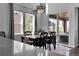 Charming dining area featuring a modern light fixture, sliding glass doors and natural light at 4781 Basalt Ridge Cir, Castle Rock, CO 80108