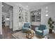 Inviting sitting room featuring an open floor plan, stylish built-in shelving and designer accents at 4781 Basalt Ridge Cir, Castle Rock, CO 80108