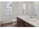 Bathroom featuring modern finishes, including a large mirror, and a bath tub at 13392 E 110Th Way, Commerce City, CO 80022