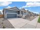 Charming home featuring a two-car garage, landscaped front yard, and inviting entrance at 13392 E 110Th Way, Commerce City, CO 80022