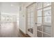 Bright living room area with hardwood floors and white walls at 13392 E 110Th Way, Commerce City, CO 80022
