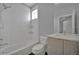 Well-lit bathroom featuring a tub and modern vanity at 3520 W Conejos Pl # 14, Denver, CO 80204