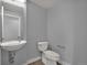 Modern half bathroom with sleek fixtures, vessel sink, and minimalist design at 3520 W Conejos Pl # 14, Denver, CO 80204