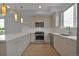 Modern kitchen features stainless steel appliances, white countertops, and wood-grain cabinets at 3520 W Conejos Pl # 14, Denver, CO 80204