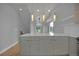 Open-concept kitchen with spacious island, modern cabinets, and pendant lighting at 3520 W Conejos Pl # 14, Denver, CO 80204