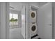 Convenient laundry room with stacked washer and dryer units at 3520 W Conejos Pl # 14, Denver, CO 80204