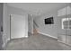 Open-concept living room with tile flooring, large closet, and a staircase to the upper level at 3520 W Conejos Pl # 14, Denver, CO 80204