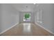 Spacious room filled with natural light from a large window; ready for your personal touches at 3520 W Conejos Pl # 14, Denver, CO 80204