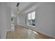 Bright, spacious living room with hardwood floors and natural light from large windows at 3520 W Conejos Pl # 14, Denver, CO 80204