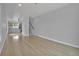 Bright and spacious living area with hardwood floors, open floor plan, and staircase at 3520 W Conejos Pl # 14, Denver, CO 80204