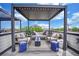 Roof top deck featuring comfortable lounge seating and stylish accents at 3520 W Conejos Pl # 14, Denver, CO 80204