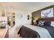 Inviting primary bedroom features a comfortable bed, stylish decor, and a serene ambiance at 9694 Canberra Dr, Highlands Ranch, CO 80130