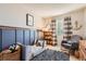 Charming bedroom featuring stylish decor and a comfortable rocking chair near a sunlit window at 9694 Canberra Dr, Highlands Ranch, CO 80130