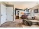 Open-concept living room with kitchen and dining views, providing great flow for entertaining at 9694 Canberra Dr, Highlands Ranch, CO 80130