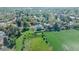 Overhead shot of the house highlighting the large backyard, mature trees, and surrounding neighborhood at 6621 S Cherry Way, Centennial, CO 80121