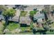Aerial view of a property with a well-maintained lawn, shed, and shade sails in the backyard at 6621 S Cherry Way, Centennial, CO 80121