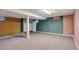 The finished basement has neutral carpet and color blocked walls at 6621 S Cherry Way, Centennial, CO 80121