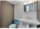 This bathroom features a blue toilet and pedestal sink at 6621 S Cherry Way, Centennial, CO 80121