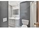 This bathroom features a shower-tub combo and a vanity with drawers and a sink at 6621 S Cherry Way, Centennial, CO 80121