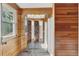 Wood paneled bathroom featuring a three-door mirror closet and walk-in shower at 6621 S Cherry Way, Centennial, CO 80121