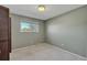 This bedroom features a window that allows in ample natural light and a closet at 6621 S Cherry Way, Centennial, CO 80121