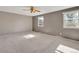 Large bedroom with ceiling fan and two windows providing ample natural light at 6621 S Cherry Way, Centennial, CO 80121
