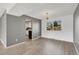 Dining area with stylish flooring, modern light fixture, and open access to the kitchen at 6621 S Cherry Way, Centennial, CO 80121