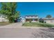 Inviting home with a spacious front yard, attached garage, and traditional two-story design at 6621 S Cherry Way, Centennial, CO 80121