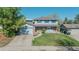 Charming two-story home featuring blue siding, brick accents, and a well-manicured front lawn at 6621 S Cherry Way, Centennial, CO 80121
