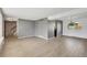 Spacious living area with gray walls, wood floors, and an open layout connecting multiple rooms at 6621 S Cherry Way, Centennial, CO 80121