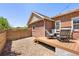 Backyard showcasing a spacious deck with patio furniture and a gravel area, perfect for entertaining at 14833 E Crestridge Dr, Centennial, CO 80015