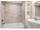 Clean, bright bathroom with modern sink, vanity, and tiled shower and tub at 14833 E Crestridge Dr, Centennial, CO 80015